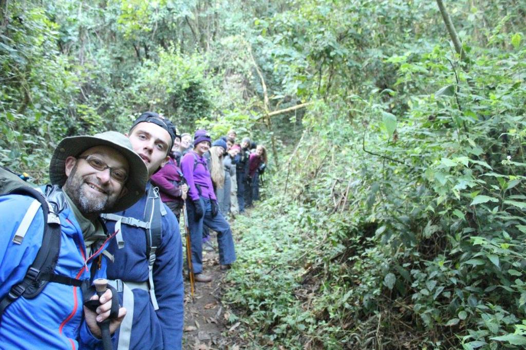 Jungle trek group in dense forest